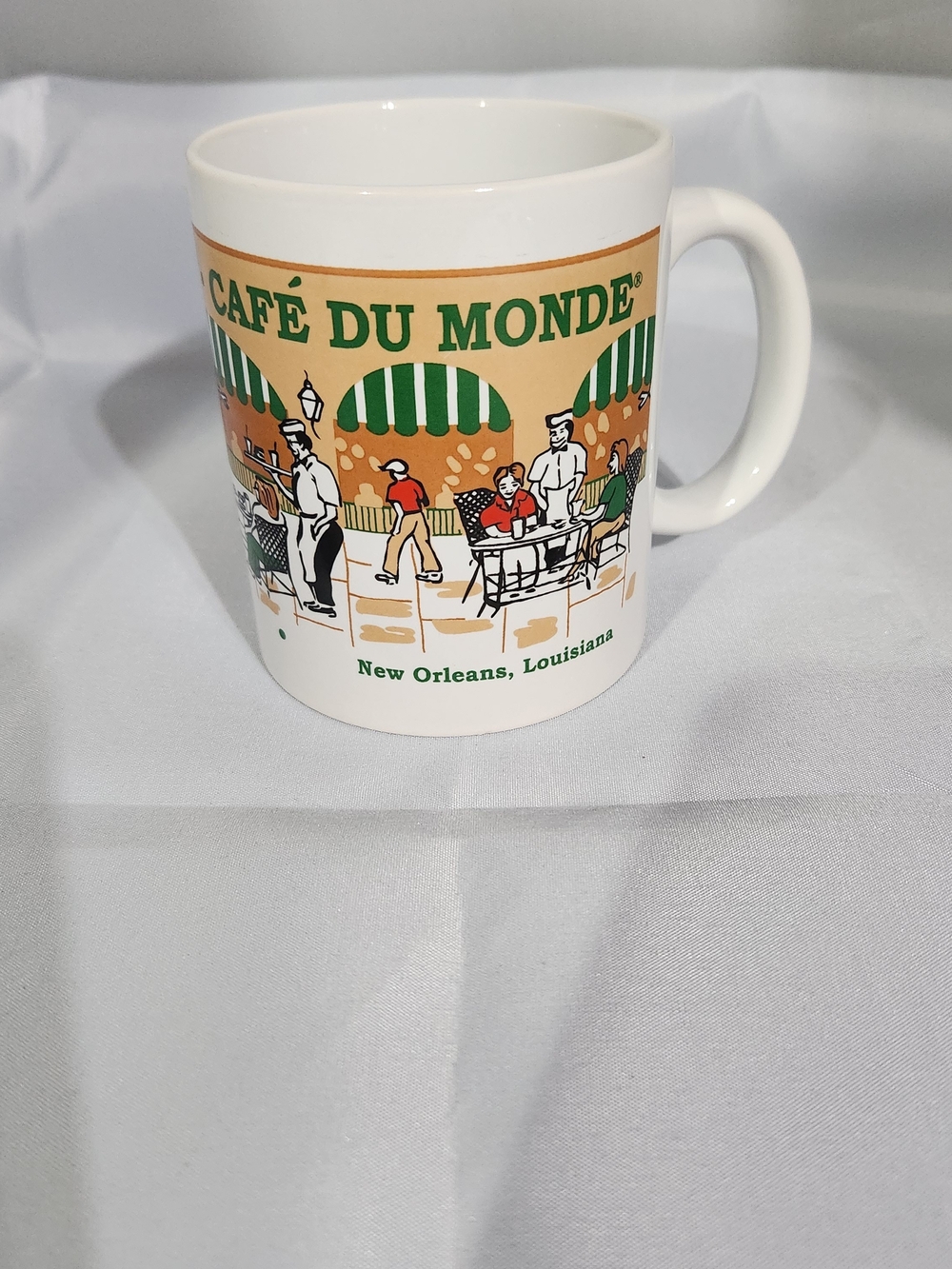White Ceramic Mug with Green and Tan New Orleans Design